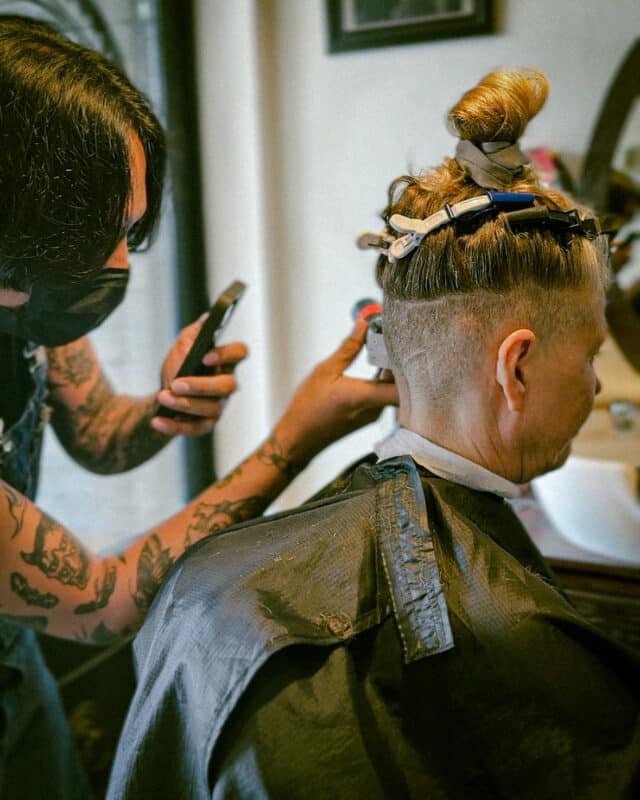 Sharp Edge Barber Seminyak interior and barbers at work